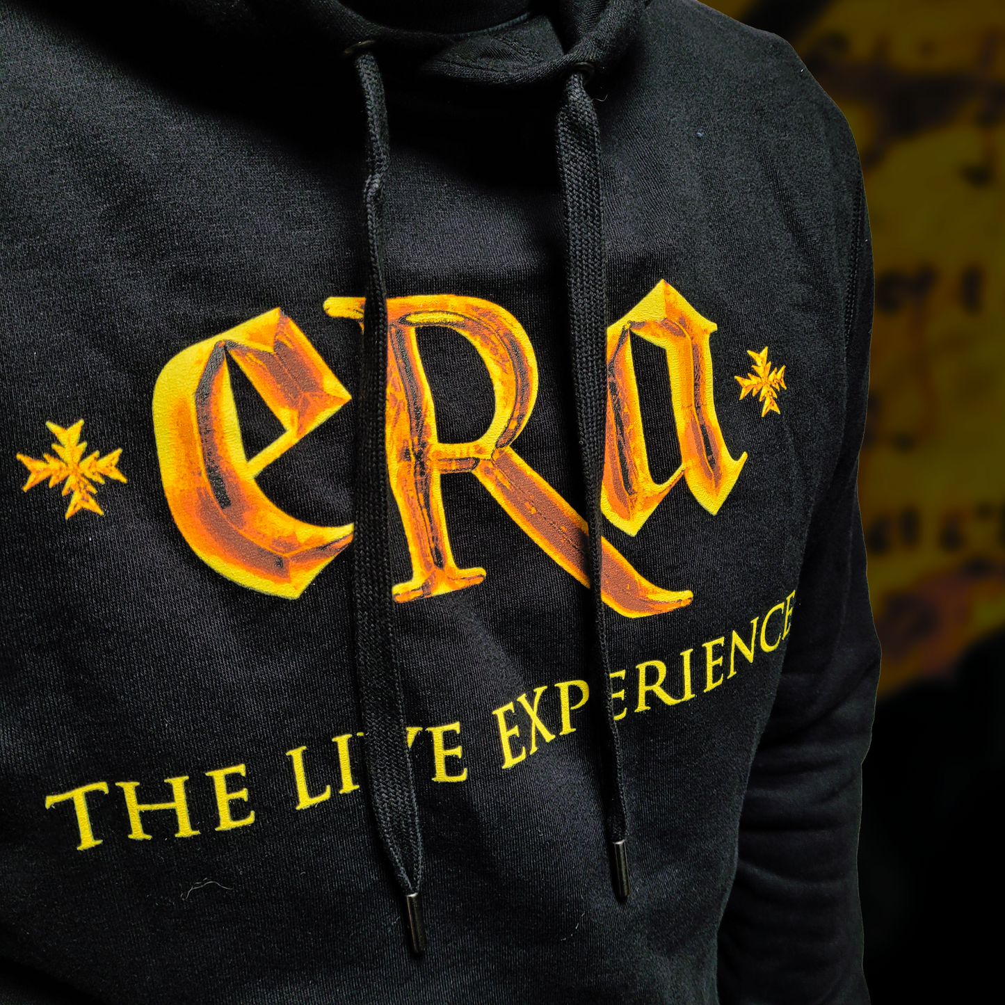 Black unisex hoodie with "ERA - The Live Experience" print 